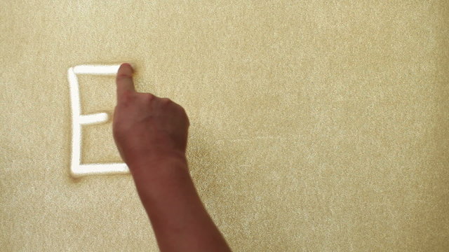 Energy, drawn by a finger on sand, Sand Painting