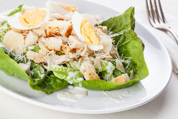 Caesar salad with eggs and chicken breast