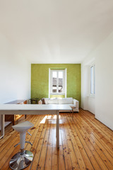 home interior, view of studio with white sofa and desk