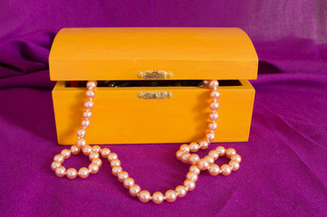 pearl necklace in an old box orange