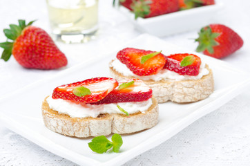 bruschetta with goat cheese, fresh strawberries and mint