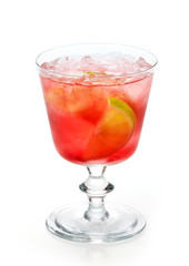 red cold drink with ice and lime