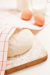 Dough on wooden board