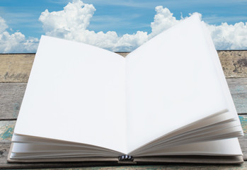 Open book with big cloud background