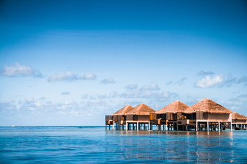 Over water bungalows with steps into amazing green lagoon