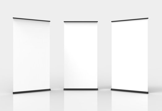 Three blank roll-up poster banner displays