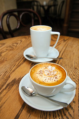 two cups cappuccino and latte