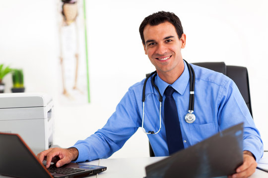 medical doctor working in office