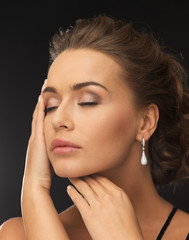 woman wearing diamond earrings