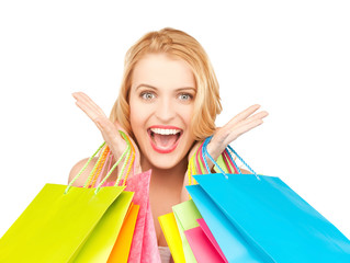 excited woman with shopping bags