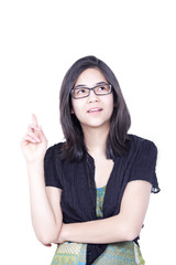 Obraz premium Young biracial teen girl, standing with raised finger pointing t