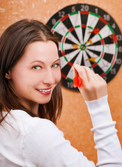 woman playing darts