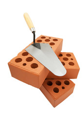 trowel and bricks isolated on white