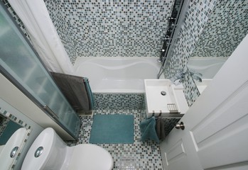 Small, modern bathroom interior. Mosaic tiles.