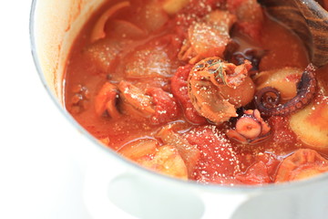 Cooking of Italian food, octopus and potato stew