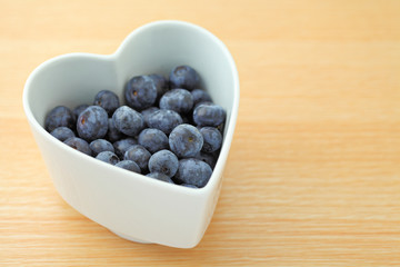 blueberry on heart shape bowl