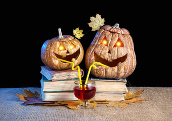 Funny Halloween pumpkins drinking wine