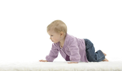 happy crawling baby with colored cubes, isolated on white