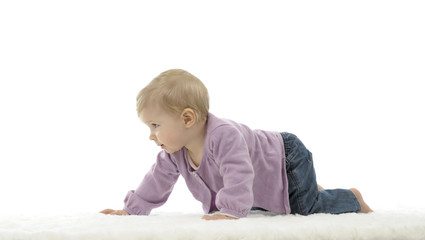 happy crawling baby with colored cubes, isolated on white