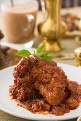 curry chicken, indian cuisine with traditional food items on bac