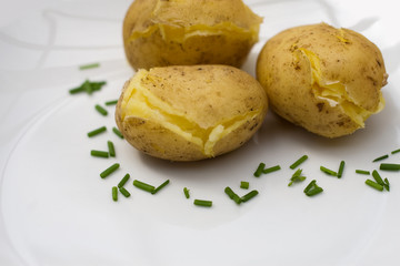 baked potatoes on white plate