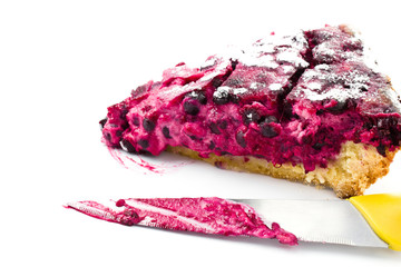 Obraz premium A piece of blueberry pie and knife isolated on white background