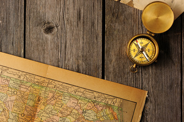 Antique compass over old map