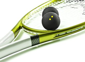 Green and silver squash racket and balls