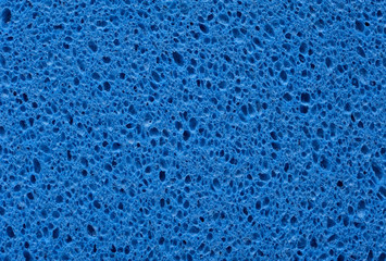 Fototapeta na wymiar Gąbka z niebieskim tle tekstury porowatej