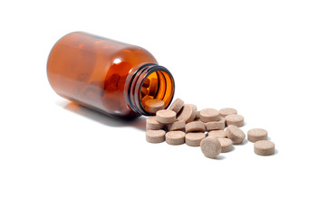 Medicine pills  in vial isolated on white background