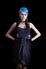 Fototapeta na wymiar Young slim goth woman with blue hair