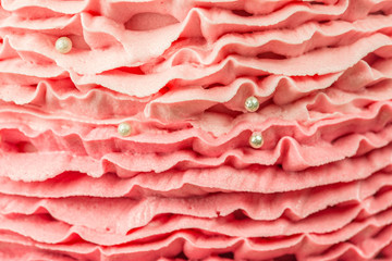 Texture of Chocolate mud cake decorated with pink ruffle pattern