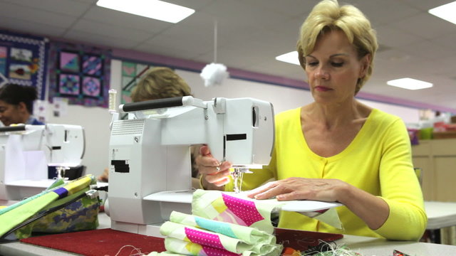 Woman Sewing Using Electric Machine