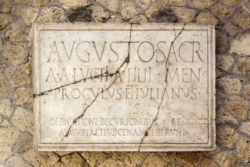 Latin inscription on plaque in Herculaneum near Vesuvius Italy