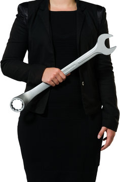 Female manager holding wrench