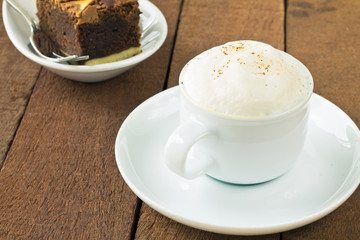 Cup of latte macchiato with cocoa powder