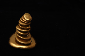Gold Pebble contemplkation of richness