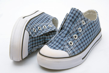 blue shade kids sneekers pair sport shoes on white