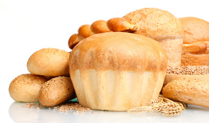 delicious round bread, buns and wheat isolated on white