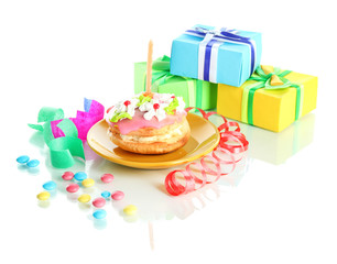 Colorful birthday cake with candle and gifts isolated on white