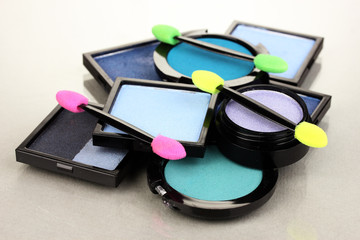 Bright eye shadows and sponge brushes for foundation