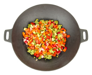 Vegetable ragout in wok, isolated on white