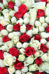 Red and white roses in a wedding centerpiece