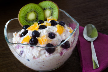 Cup of yogurt with orange and berries
