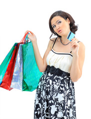 Happy young adult girl, with color-coded bags.