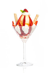 sundae with vanilla ice cream and strawberries