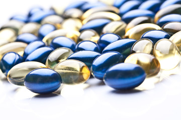 colorful vitamin gel capsules isolated on whiteback ground 