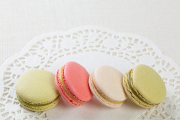 Delicious macaroons on vintage background
