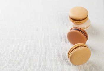 Delicious macaroons on vintage background