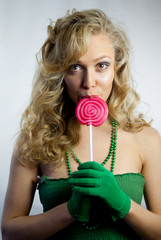 Young woman eating lollipop